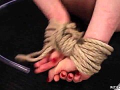 Brunette dominates and spanks blonde lesbian in BDSM video