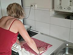 Mature stepmom with big boobs and hairy pussy gets down and dirty in the kitchen