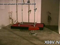 Femdom porn featuring a woman tied up and bound in rough domination scenes