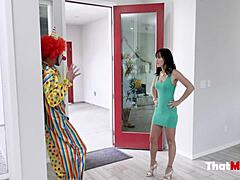 Alana Cruise, a busty brunette housewife, gets intimate with a clown on Halloween